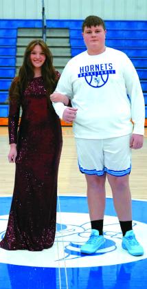 Freshman attendant Megan Kinney escorted by Landry Highswonger.
