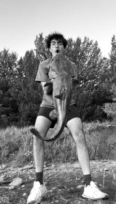 Roman Bintz with a flathead catfish caught at Ponca Lake.