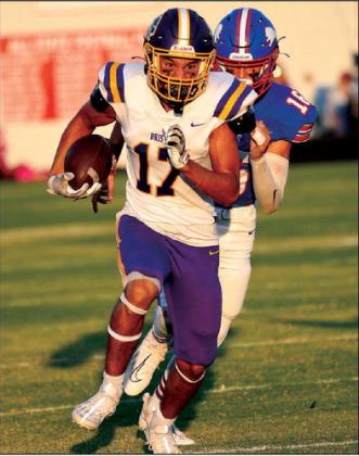 Bristow Kaden Hooks picks up yardage in the first half.