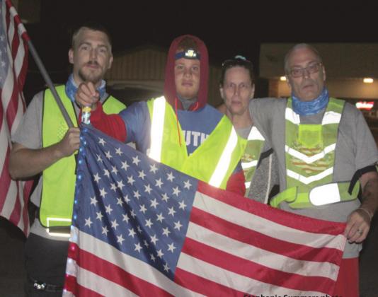 Great American relay runners from left, Brandon Dillion, Cameron Beal , Jaime Andrews and baton carrier Terry Montgomery. Stephanie Summers photo