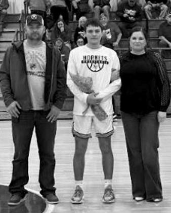EthanHoganwithparentsBobbyHoganandKellySample. courtesy photo