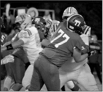 Christopher White and Gavin Shagena block Weleetka.