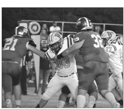 Brothers Brock and Seth McDaniel block the opponents.