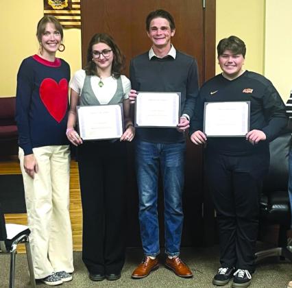 From left: Jessica Frizzell stands with her students, Eva Roberts, Isaiah Wilson, and Wake Tidwell, as they were recognized for attaining All-State status the evening of November 11. courtesy photo