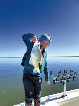 Huck N. with a white crappie caught at Canton Lake.