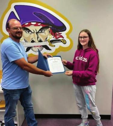 Commander Justin Adair presents Sydney Gass with award. courtesy photo