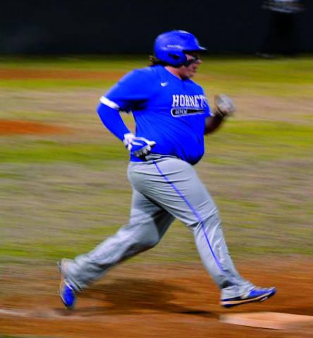 courtesy photo Christopher White rounds first base.