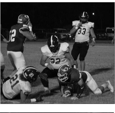 Matthew Brown, Seth McDaniel and Warner Vanorsdol play defense. courtesy photo