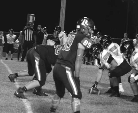 The Hornet defense blocks the opponents play.