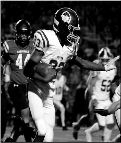 Rebecca Langston photo Caleb Alexander runs the ball down the field.