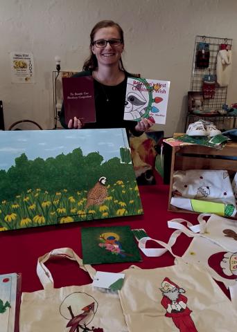 Kylie Shockley, Bramble Cave artist and author, was at The Old Crow Showroom Saturday, doing a book signing. Shockley is the author of a children’s book and a recipe book, along with being an artist, showing some of her art work during the signing. courtesy photo