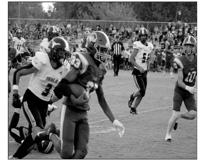Caleb Alexander runs the play.