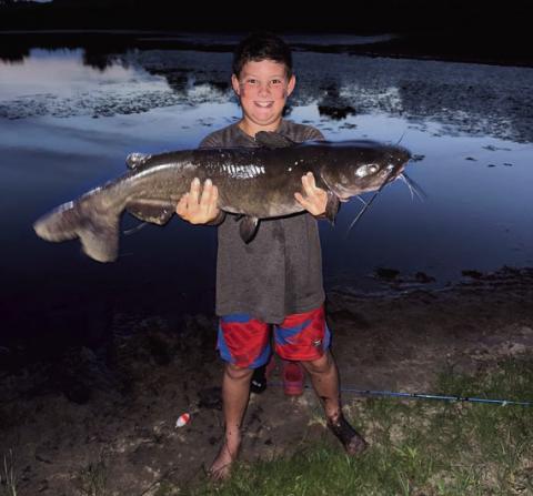 Jase R. with a channel catfish caught in Carter County courtesy photo