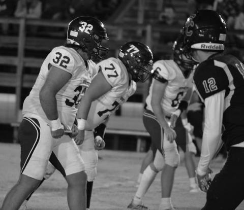 Seth McDaniel, Christopher White and Jess Smith play defense.