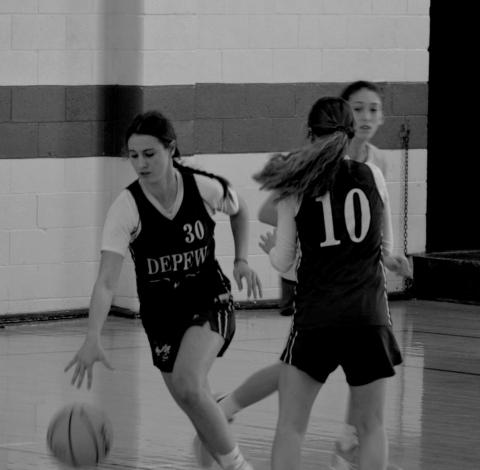 #30 Katrina Ash and #10 Morgan Steele make the play.