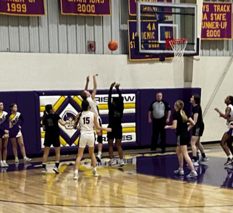 ShaLyn Edmondson stands guard as Ava yocham makes the shot. courtesy photo