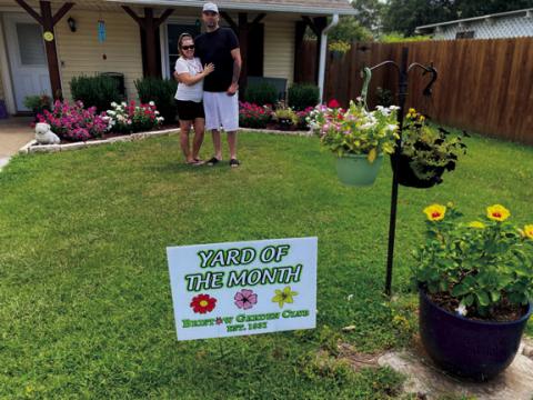 The Bristow Garden Club’s Yard of the Month for August goes to Josh Titus, 111 North Oak Street. Josh is shown here with his daughter Jayla. courtesy photo
