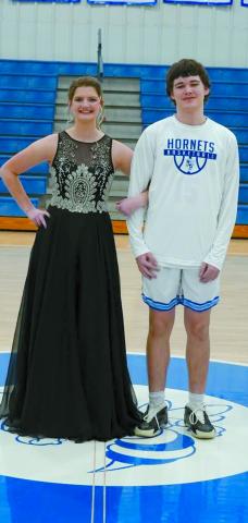 Junior attendant Audrey Hoover escorted by Chris Peterman.